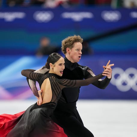 Madison Chock and Evan Bates of the United States skate during the Milano Cortina 2026 Olympic Winter Games at Milano Ice Skating Arena.