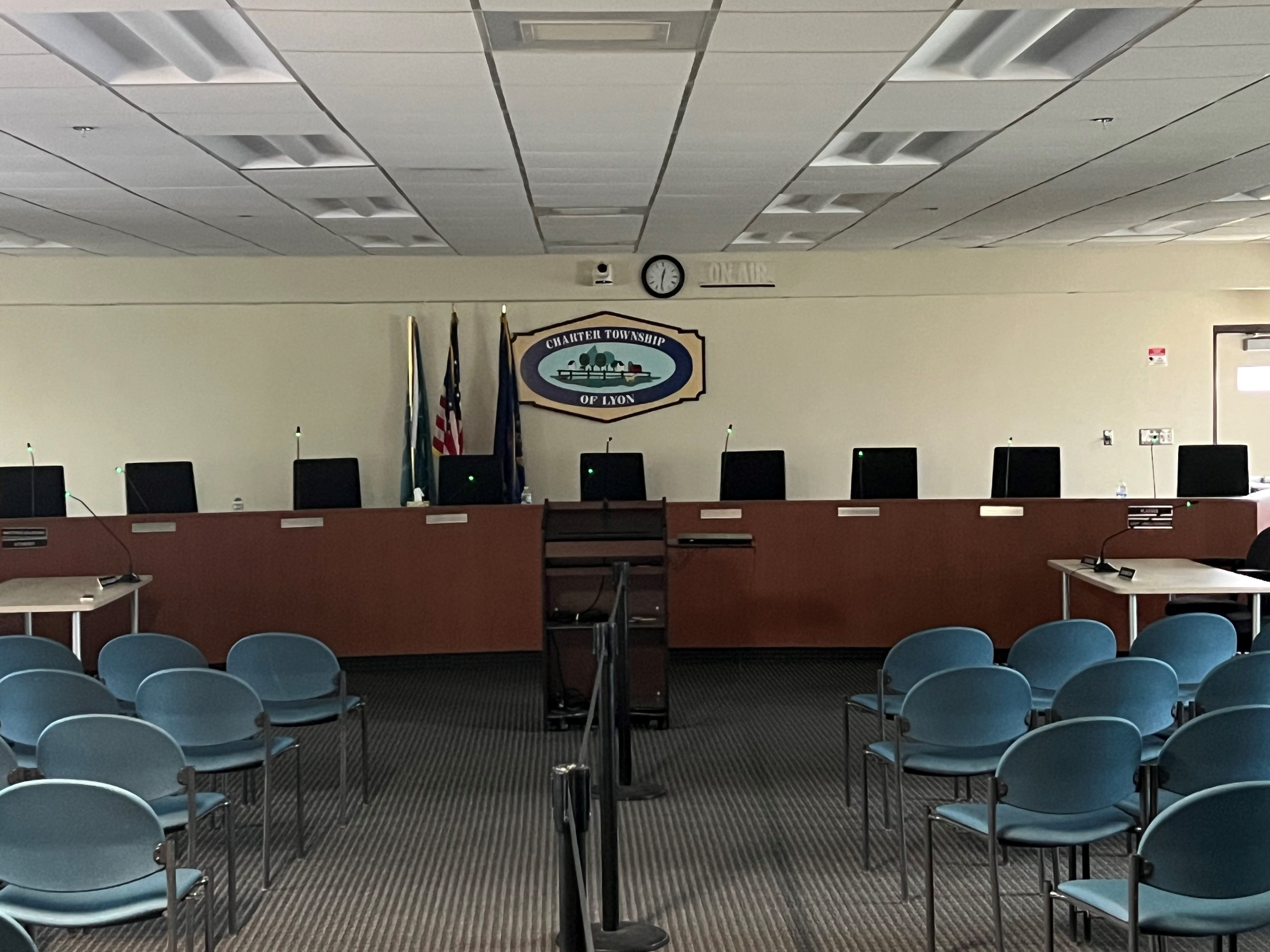 https://www.gannett-cdn.com/authoring/authoring-images/2026/04/28/POEN/89842643007-lyon-township-board-room.jpg?auto=webp&crop=4031,2268,x0,y453&format=pjpg&width=1200