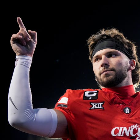 Oct 25, 2025; Cincinnati, Ohio, USA; Cincinnati Bearcats quarterback Brendan Sorsby points to fans as he walks off the field after defeating the Baylor Bears at Nippert Stadium. Mandatory Credit: Aaron Doster-Imagn Images
