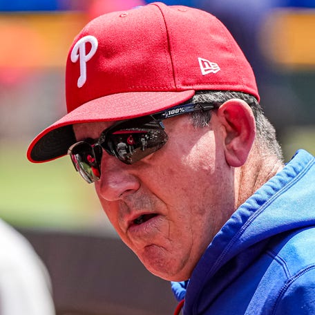 Apr 26, 2026; Cumberland, Georgia, USA; Philadelphia Phillies manager Rob Thomson (49) in the dugout during the game against the Atlanta Braves at Truist Park. Mandatory Credit: Dale Zanine-Imagn Images