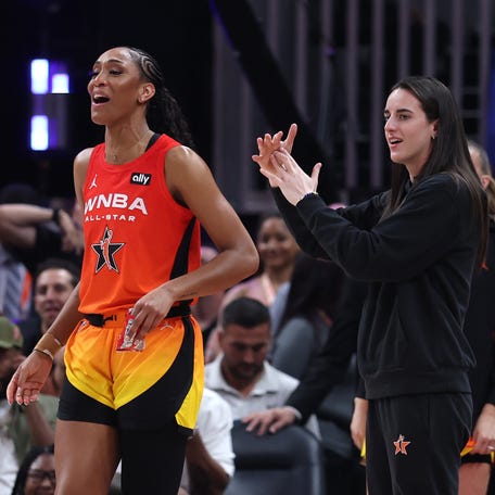 Jul 19, 2025; Indianapolis, IN, USA; Team Clark guard Caitlin Clark (22) and center A'ja Wilson (22) react on the bench in the fourth quarter against Team Collier the 2025 WNBA All Star Game at Gainbridge Fieldhouse. Mandatory Credit: Trevor Ruszkowski-Imagn Images
