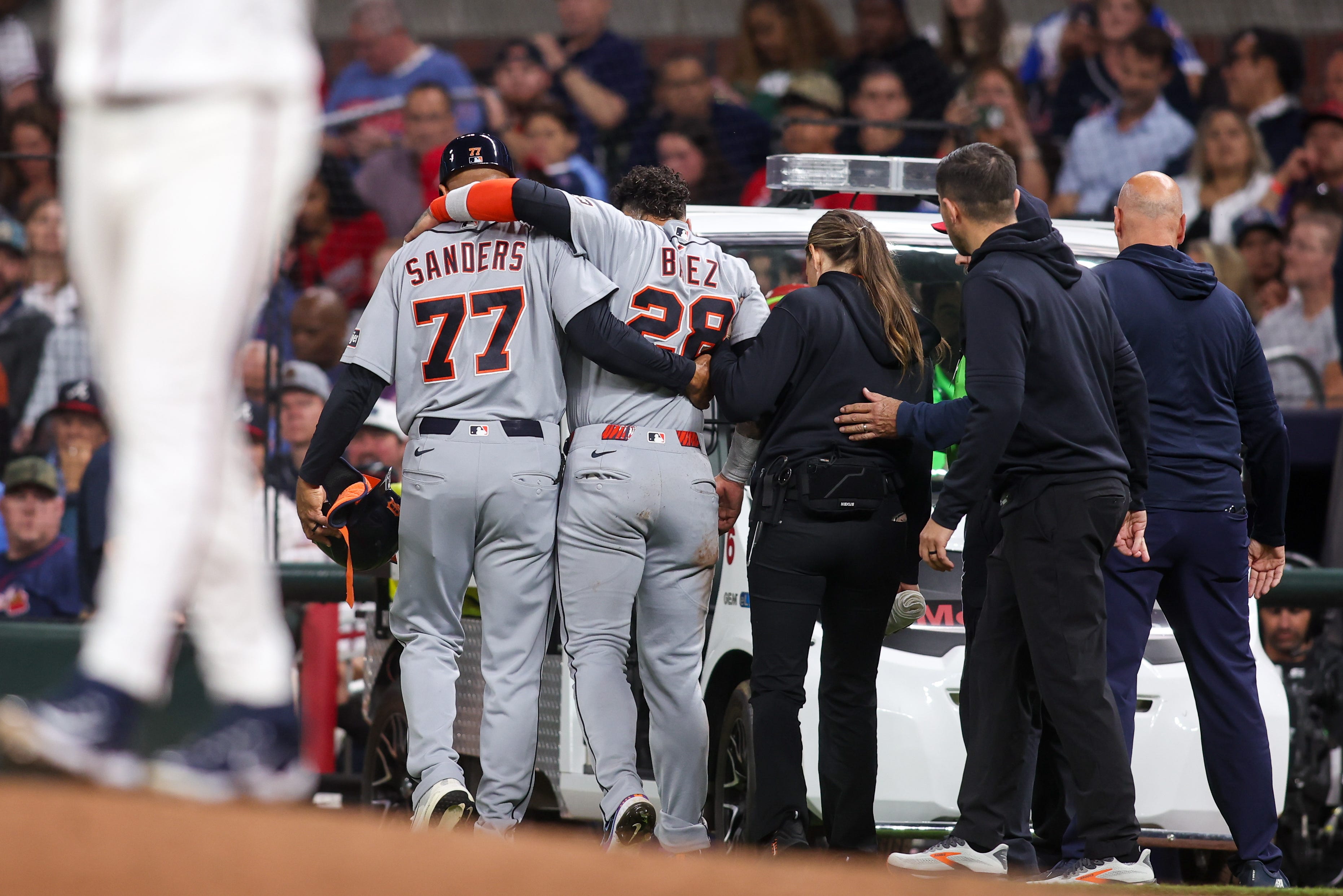 Javier Baez had to be carted off the field in Atlanta after he was injured sliding into first base.