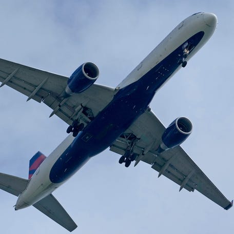 A Delta Air Lines plane flies in to land at Mitchell International Airport in Milwaukee in this file photo from May 22, 2024.