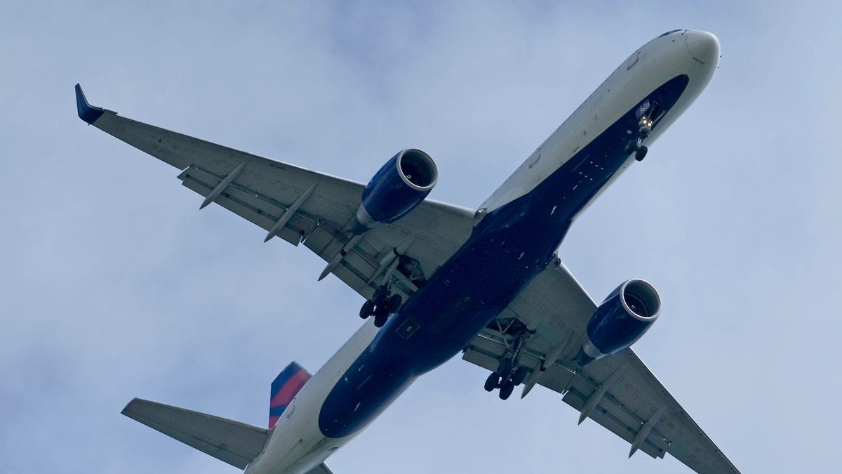 A Delta Air Lines plane flies in to land at Mitchell International Airport in Milwaukee in this file photo from May 22, 2024.