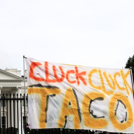 A sign reading "Cluck Cluck TACO" outside the White House after U.S. President Donald Trump cut his G7 trip short and returned as the Israel-Iran air war continues, in Washington, D.C., U.S., June 17, 2025. REUTERS/Kevin Mohatt