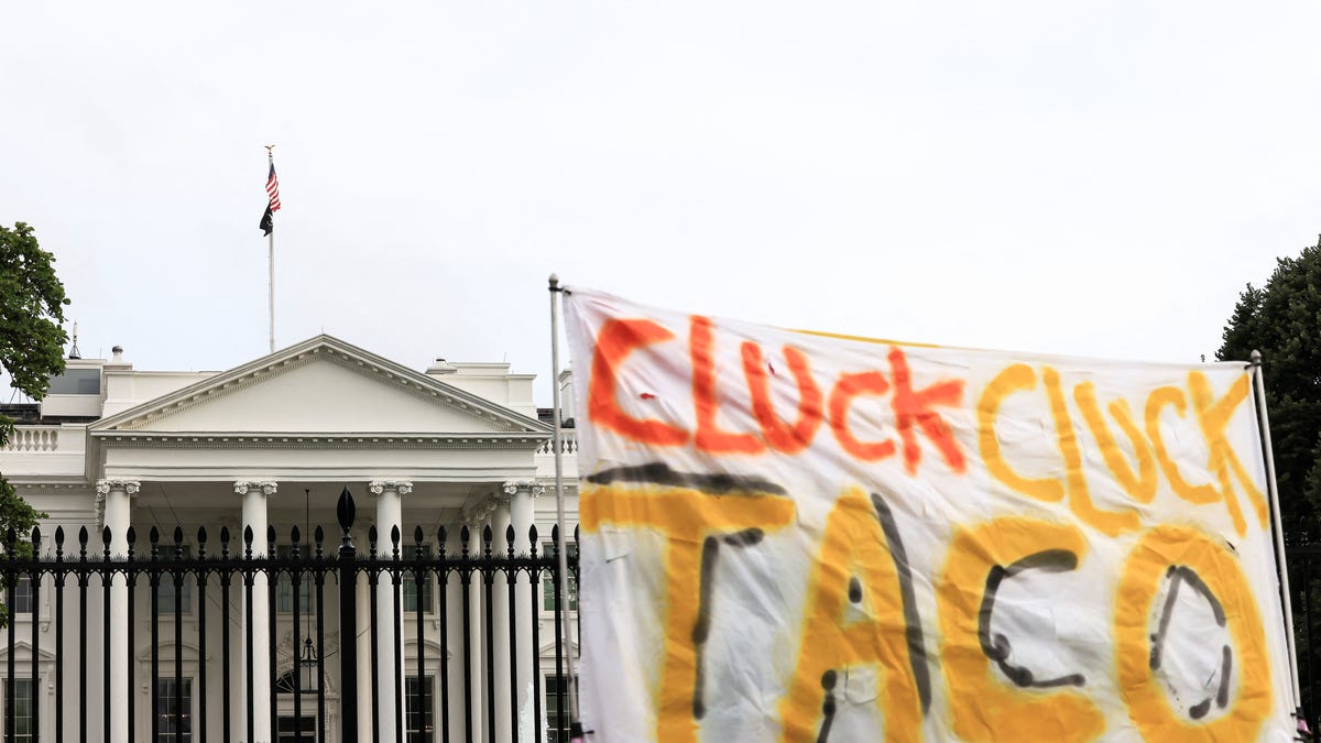 A sign reading "Cluck Cluck TACO" outside the White House after U.S. President Donald Trump cut his G7 trip short and returned as the Israel-Iran air war continues, in Washington, D.C., U.S., June 17, 2025. REUTERS/Kevin Mohatt