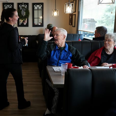 122 Diner head waitress Sarah Dwyer of Franklin jokes with regular customers John Byron and Janet Segur, both of Rutland.