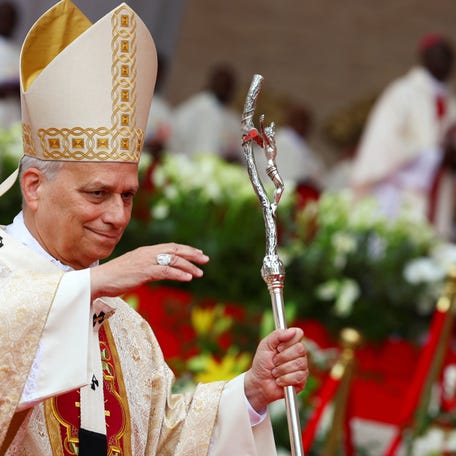 Pope Leo XIV gestures, on the day he holds a holy Mass at Malabo Stadium, on the last day of his apostolic journey, in Malabo, Equatorial Guinea, April 23, 2026. REUTERS/Guglielmo Mangiapane