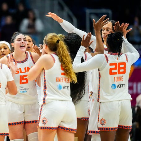 Connecticut Sun center Raegan Beers (15) celebrates with teammates after defeating the Toronto Tempo at Coca-Cola Coliseum.