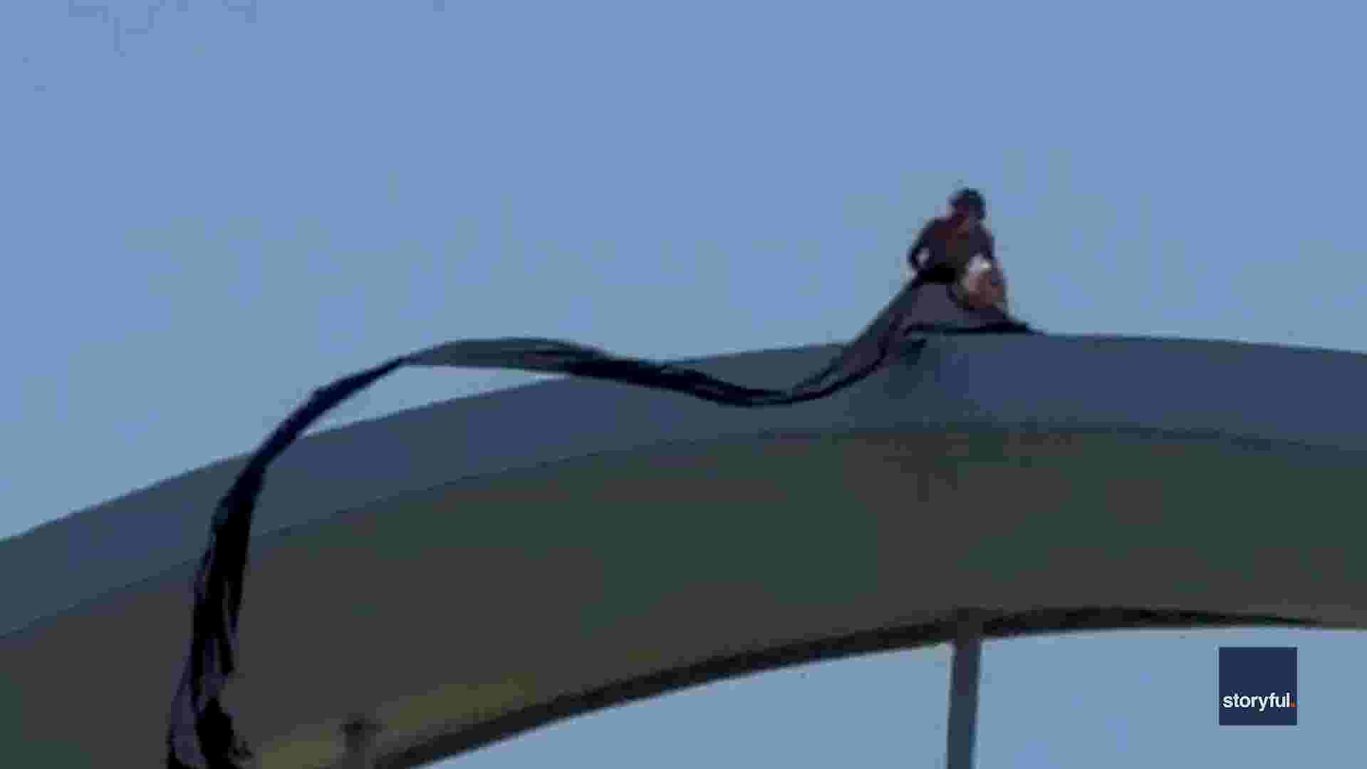 https://www.gannett-cdn.com/authoring/authoring-images/2026/05/01/USAT/89899971007-20260501-vpc-protester-climbs-frederick-douglass-bridge-thumb-00-00-00-00-still-003.jpg?crop=1919,1079,x0,y0&quality=10