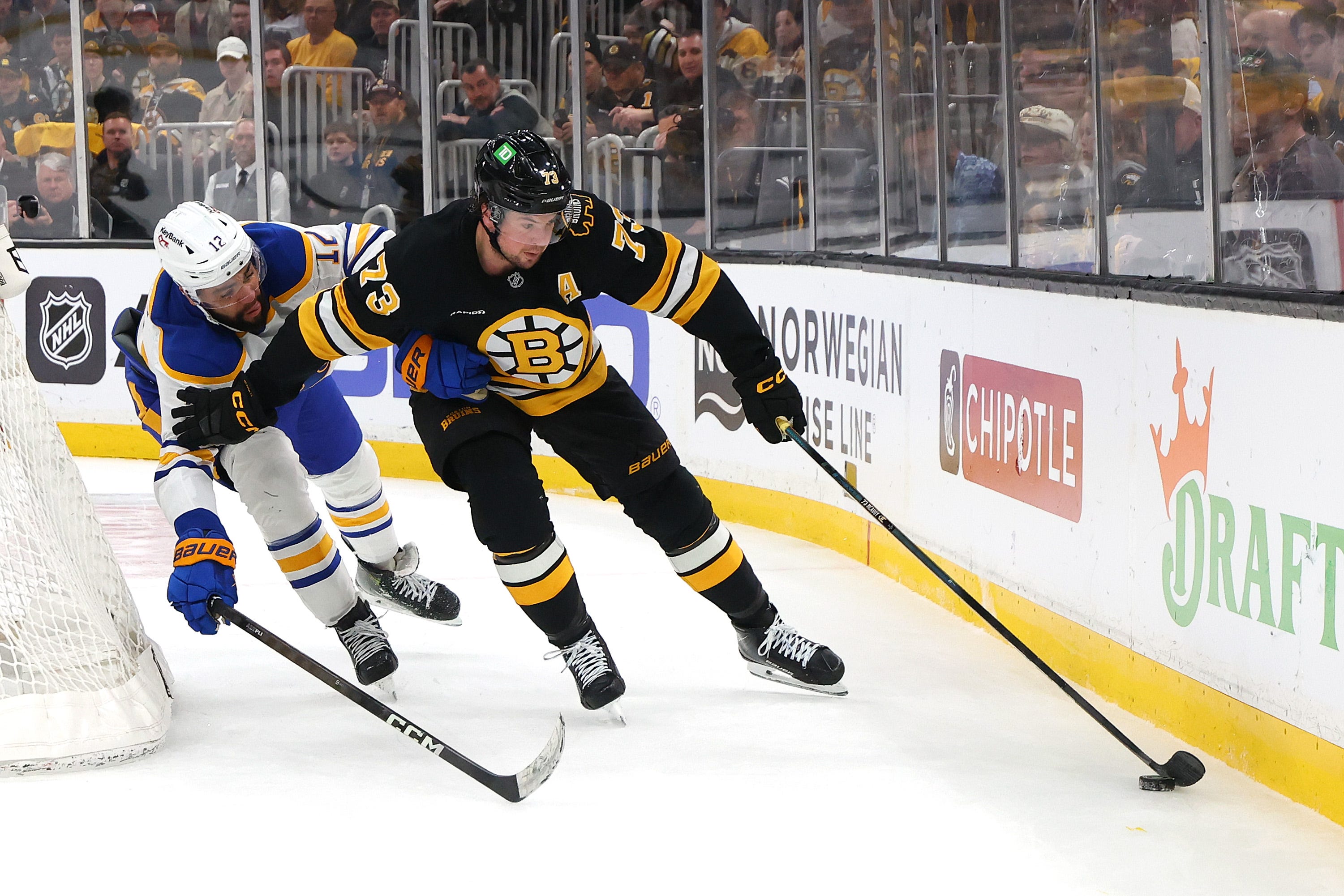 Bruins defenseman Charlie McAvoy was tossed after he swung his stick at the Sabres' Zach Benson, a retaliation for Benson's slew foot.