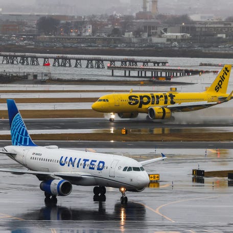 An Airbus A320 passengers aircraft of Spirit airlines arriving from Miami is pictured while an Airbus A319 of United airlines arrived from Denver are seen at LaGuardia Airport on January 9, 2024