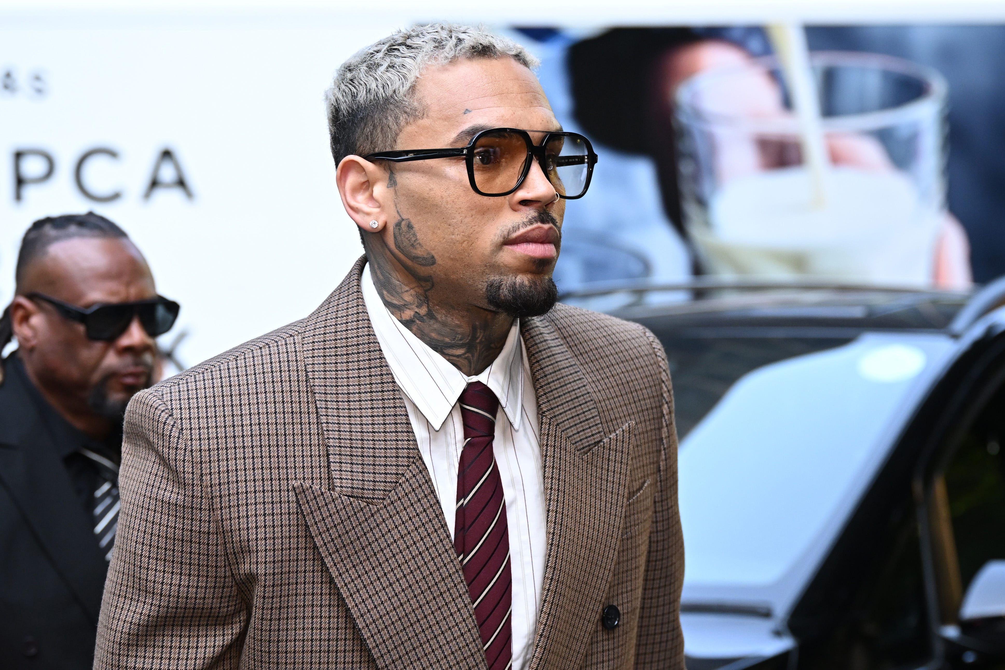 Shots fired outside Chris Brown's home led to the arrest of a Los Angeles man, who is accused of firing a CO2-style handgun, police say.