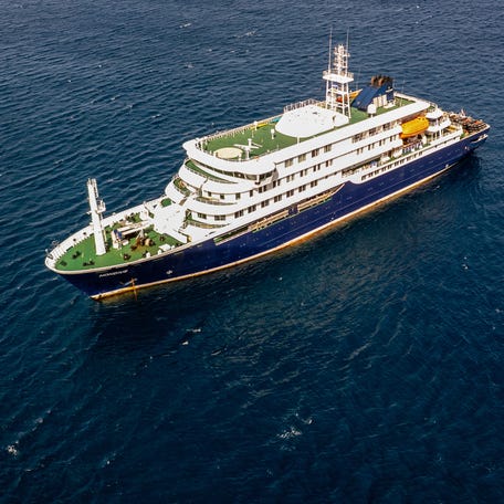 This aerial picture shows a general view of the cruise ship MV Hondius stationary off the port of Praia, the capital of Cape Verde, on May 3, 2026.
