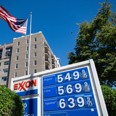 A gas station sign displays prices in Washington, D.C., U.S., May 1, 2026. REUTERS/Annabelle Gordon