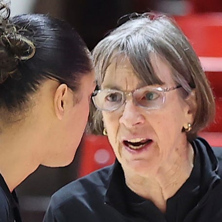 Stanford head coach Tara VanDerveer, right, speaks with guard Talana Lepolo during a break in action against Utah in 2023.