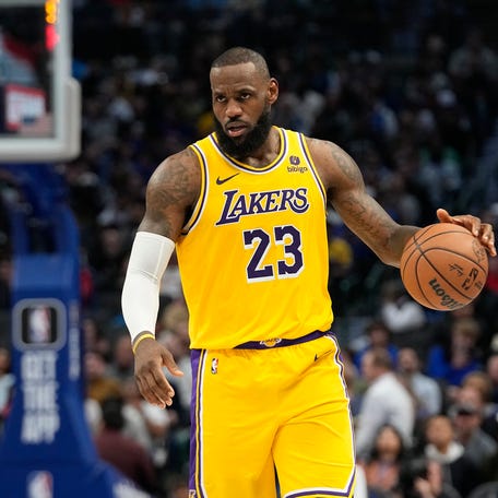Los Angeles Lakers forward LeBron James dribbles during the second half of an NBA basketball game against the Dallas Mavericks in Dallas, Tuesday, Dec. 12, 2023. (AP Photo/LM Otero)