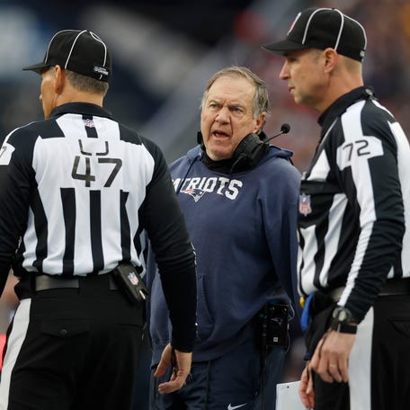 New England Patriots Bill Belichick, center, speaks with officials during the first half of an NFL football game against the Kansas City Chiefs, Sunday, Dec. 17, 2023, in Foxborough, Mass. (AP Photo/Michael Dwyer)