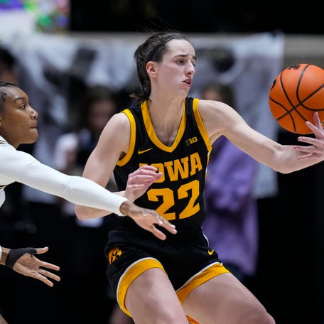 Iowa guard Caitlin Clark (22) looses the ball in front of Purdue guard Rashunda Jones (2) during the second half of an NCAA college basketball game in West Lafayette, Ind., Wednesday, Jan. 10, 2024. Iowa defeated Purdue 96-71. (AP Photo/Michael Conroy)