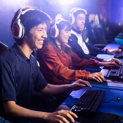 Group of young adults playing computer games toget