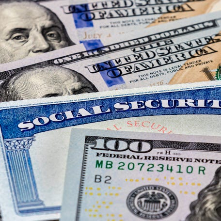 Social Security card and hundred-dollar bills.