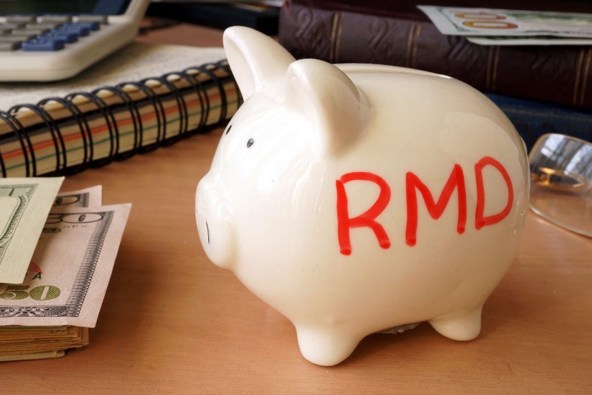 A piggy bank with the letters RMD printed on it.