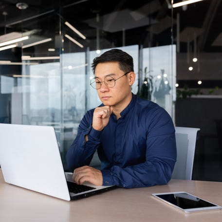 A person at a laptop.