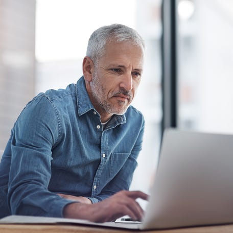 A person at a laptop.