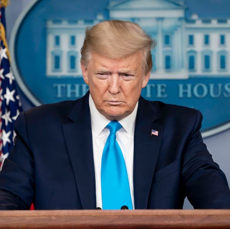 Donald Trump addressing reporters in the White House.