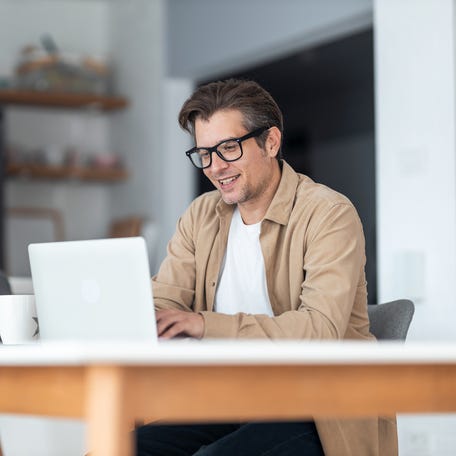 A person at a laptop.