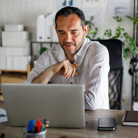 A person at a laptop.