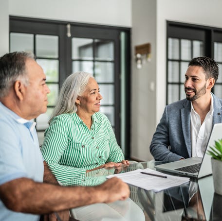 Couple meeting with financial advisor.