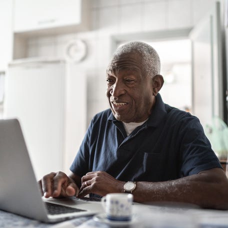 A person at a laptop.