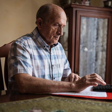 A person using a calculator.