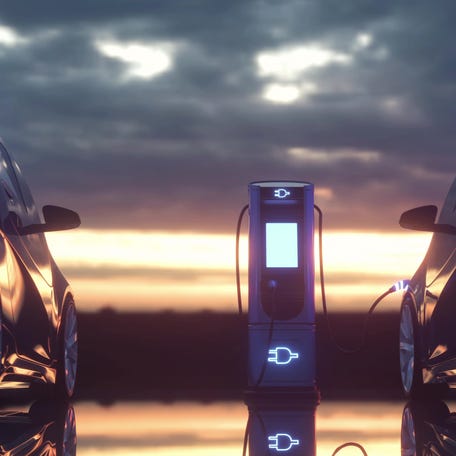 EVs charge at a charging station.