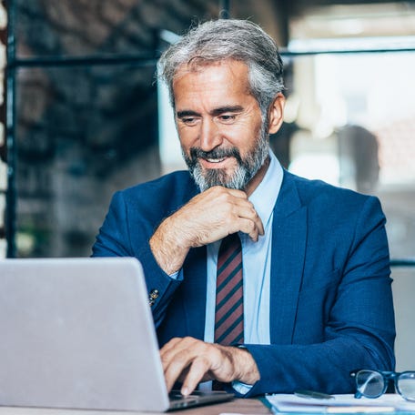 A person at a laptop.