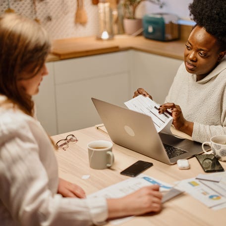 Adults looking at financial paperwork.