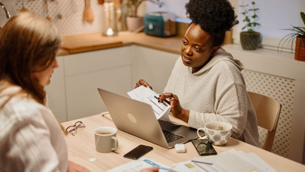 Adults looking at financial paperwork.