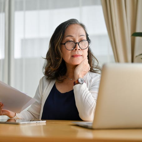 A person at a laptop.