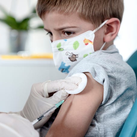 A young child receiving a shot.