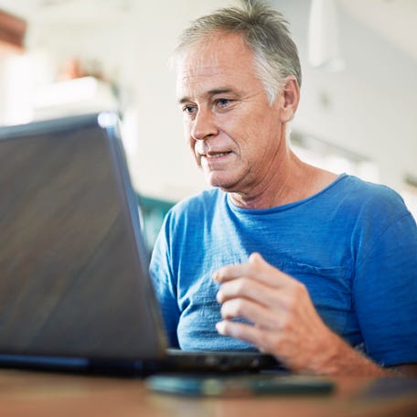 A person at a laptop.
