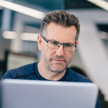 A person at a laptop.