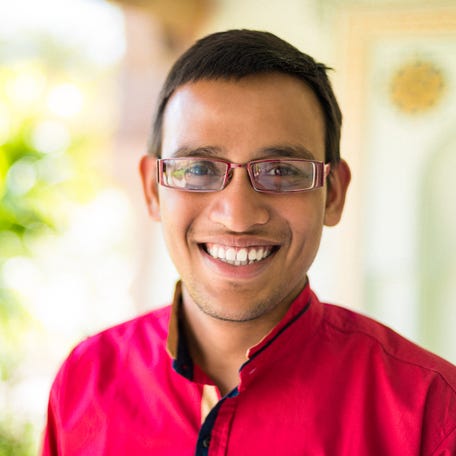 A closeup of a person smiling.