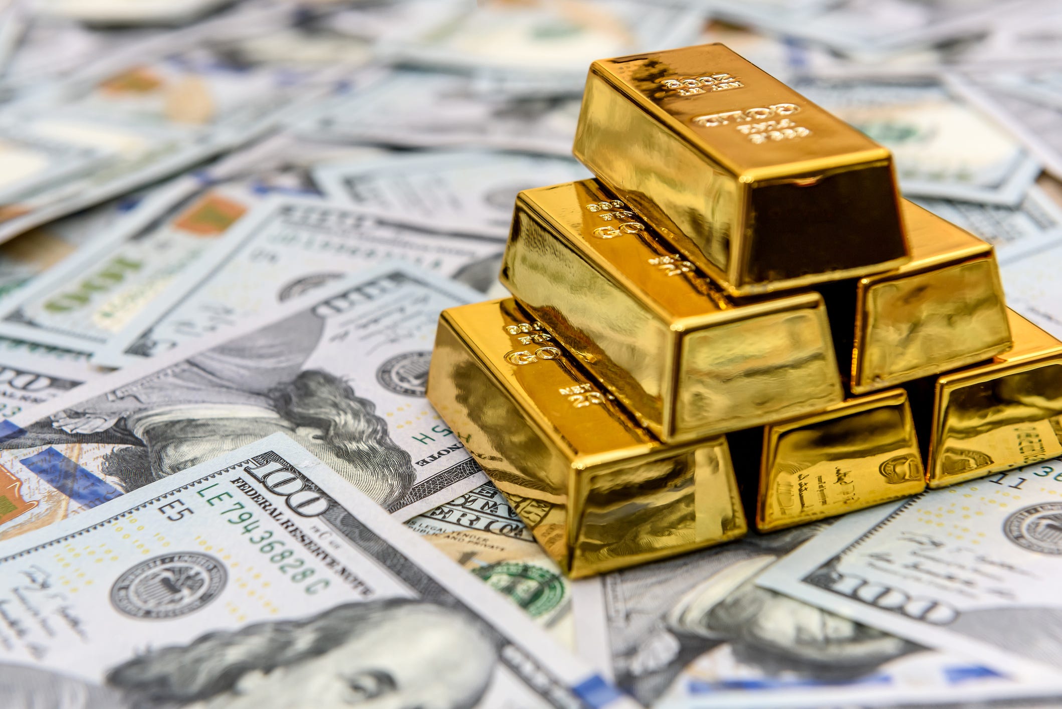 https://www.gannett-cdn.com/authoring/images/motleyfool/2026/01/29/USAT/88422498007-a-stack-of-gold-bars-sitting-on-top-of-american-dollars.jpeg?auto=webp&crop=2118,1191,x0,y111&format=pjpg&width=1200