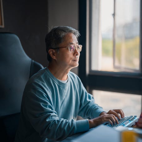 A person at a computer.