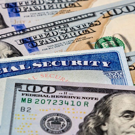 Social Security card in money.