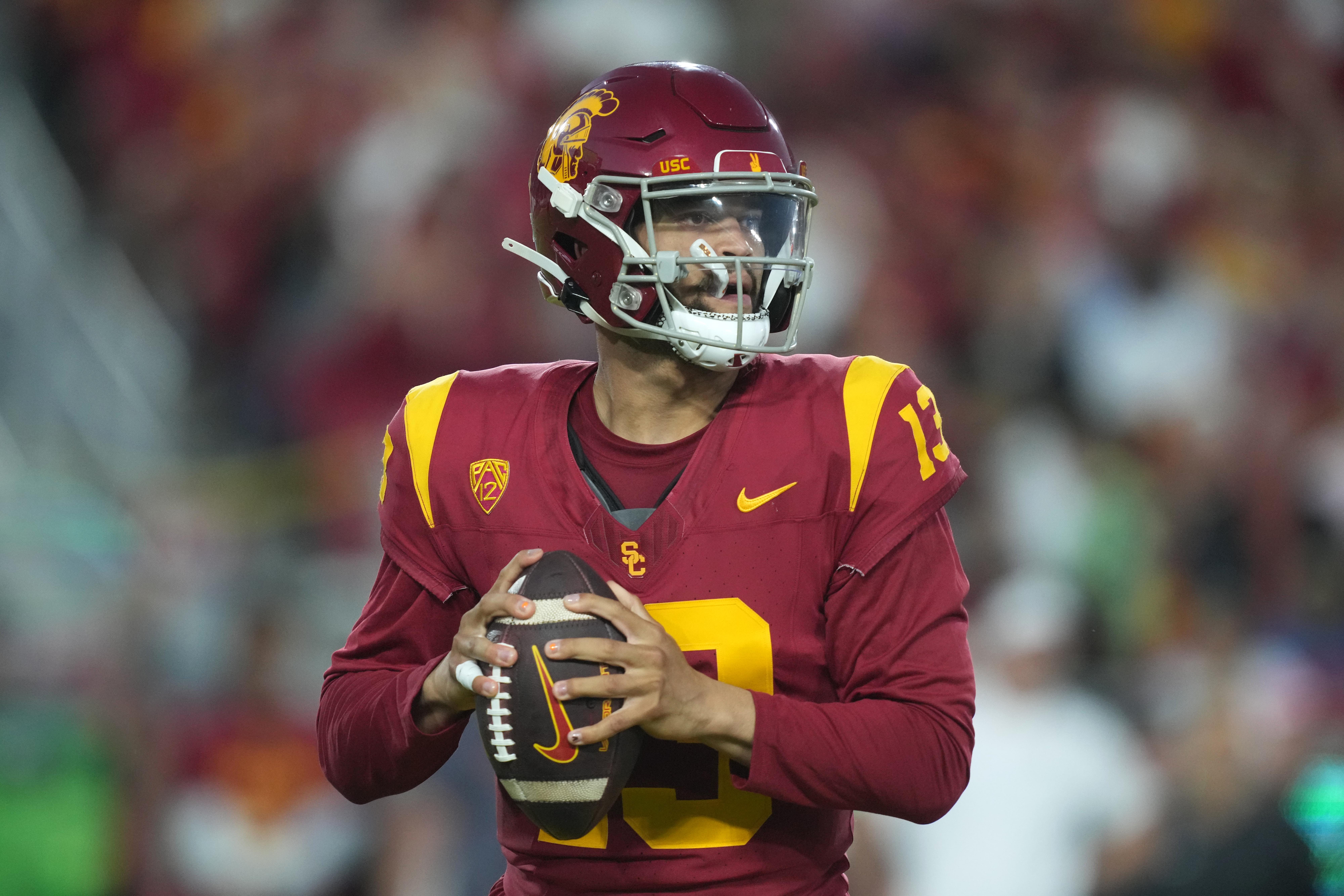 Oct 21, 2023; Los Angeles, California, USA;Southern California Trojans quarterback Caleb Williams (13) throws the ball against the Utah Utes in the first half at United Airlines Field at Los Angeles Memorial Coliseum. Mandatory Credit: Kirby Lee-USA TODAY Sports