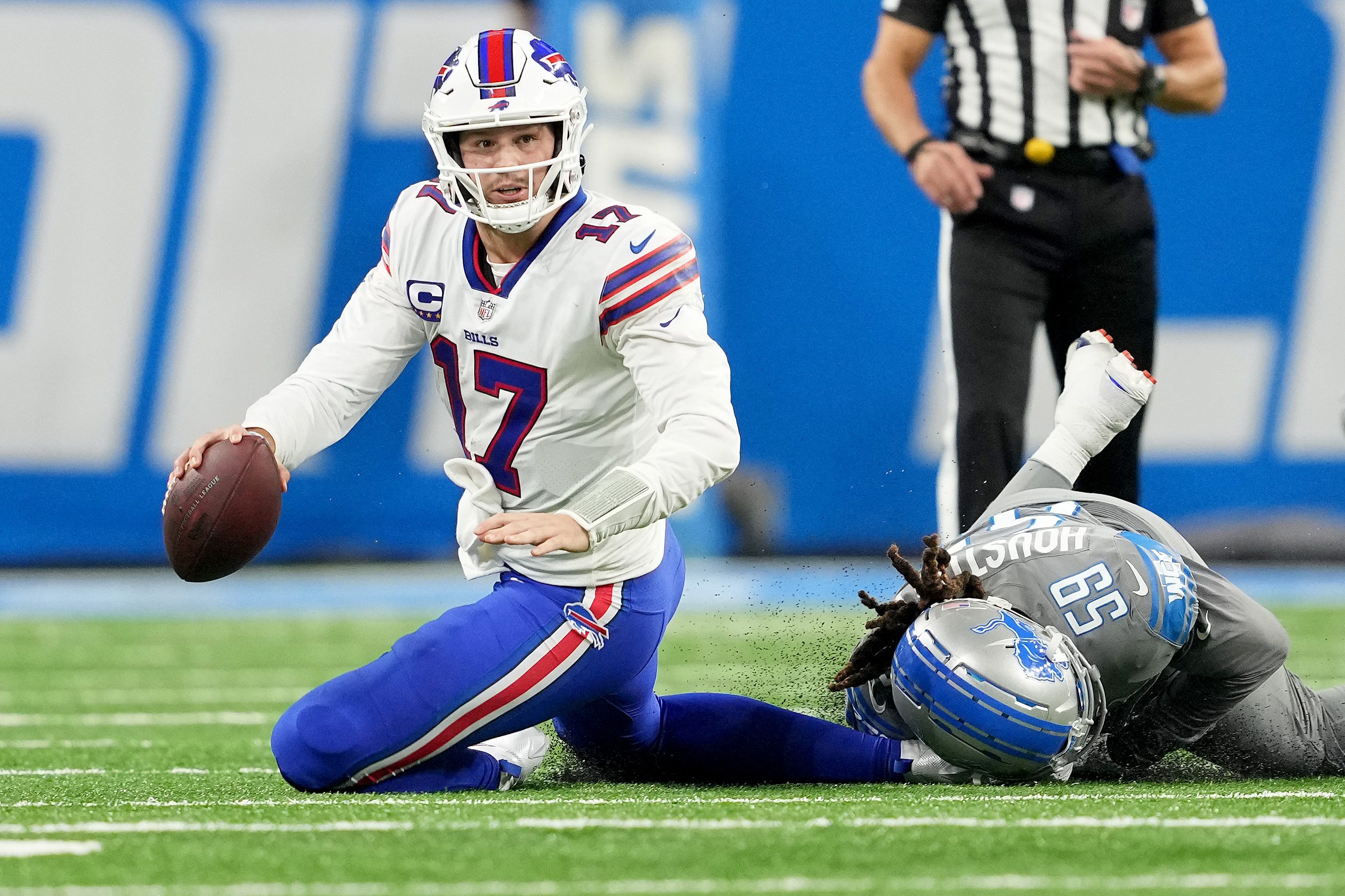 DETROIT, MICHIGAN - NOVEMBER 24: James Houston #59 of the Detroit Lions tackles Josh Allen #17 of the Buffalo Bills during the third quarter at Ford Field on November 24, 2022 in Detroit, Michigan. (Photo by Nic Antaya/Getty Images)