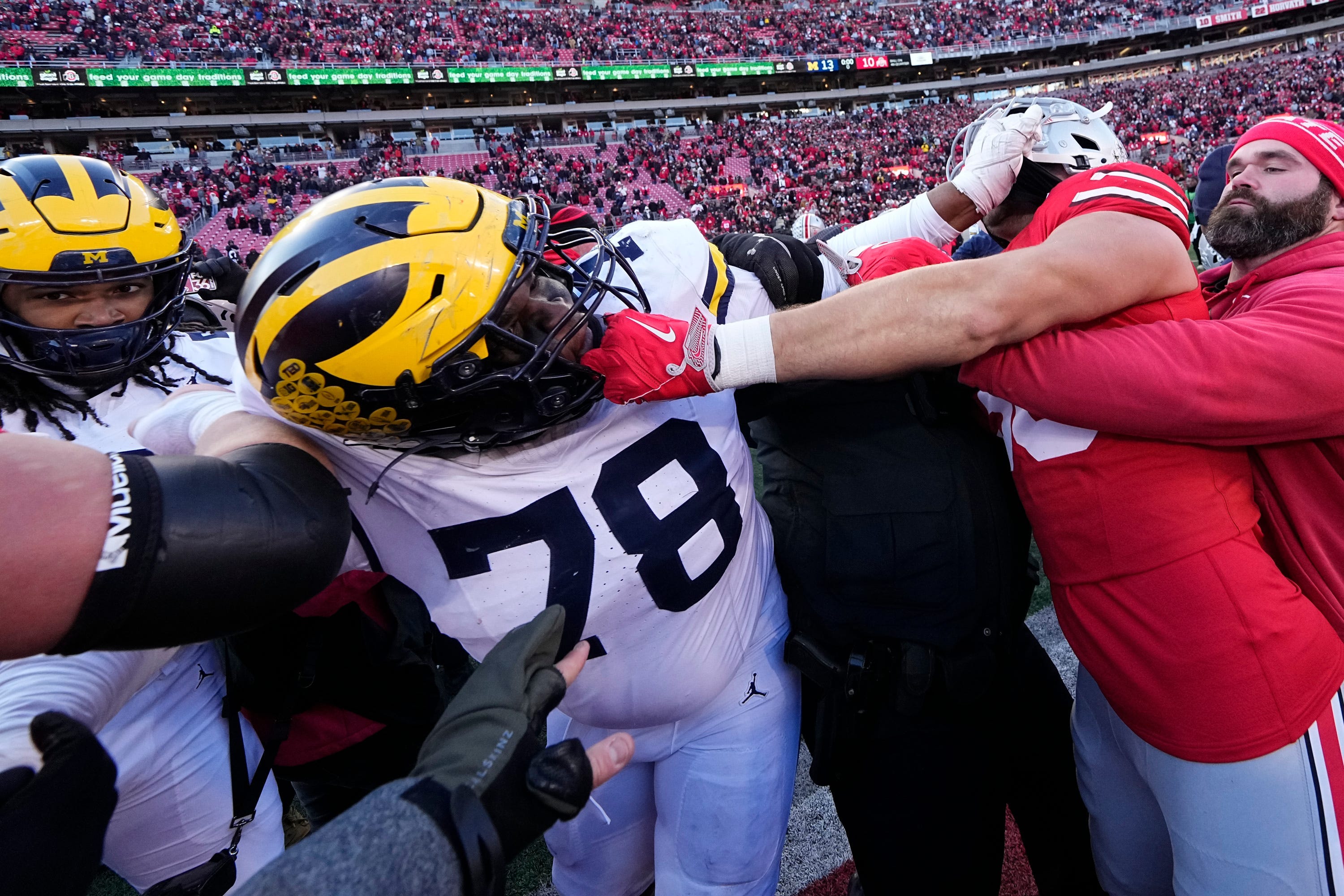 Ohio State Buckeyes and Michigan Wolverines fight following the NCAA football game at Ohio Stadium in Columbus on Saturday, Nov. 30, 2024. Michigan won 13-10.