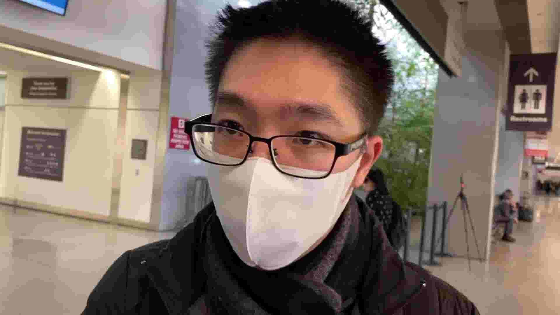 Travelers arrive in US from China wearing masks